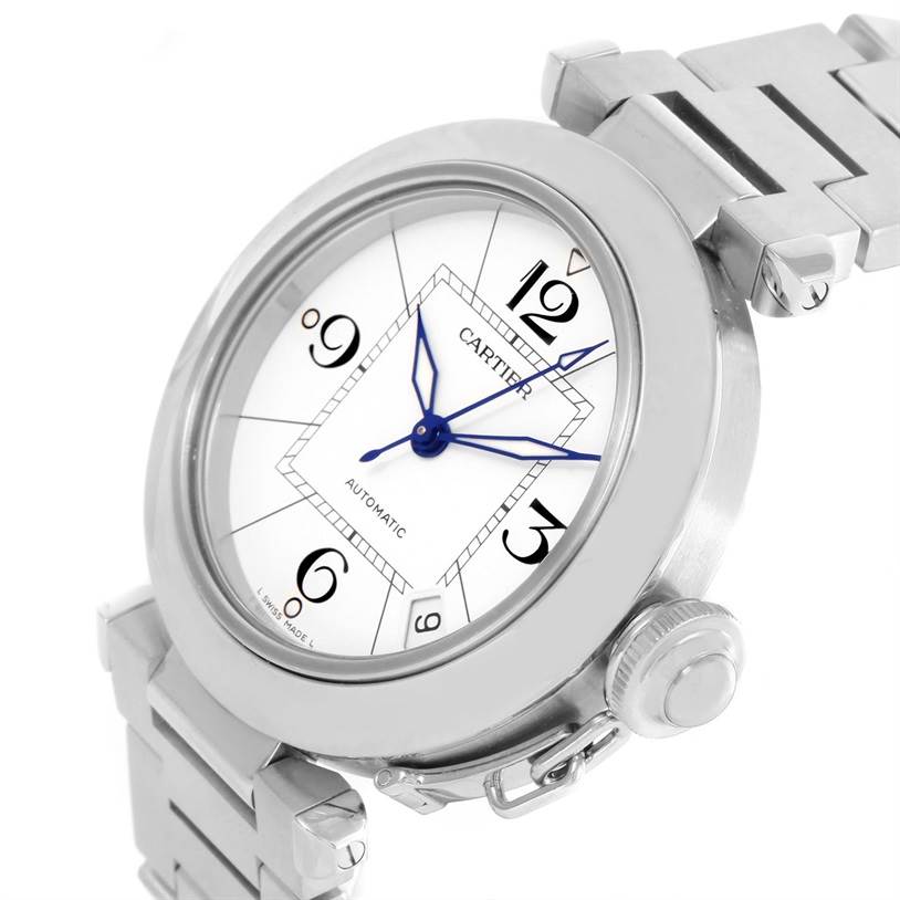The image shows a close-up of the Cartier Pasha W31074M7 Women's Stainless Steel White Dial W31074M7 Women's Stainless Steel White Dial watch from an angled view, highlighting the face, crown, and part of the bracelet.