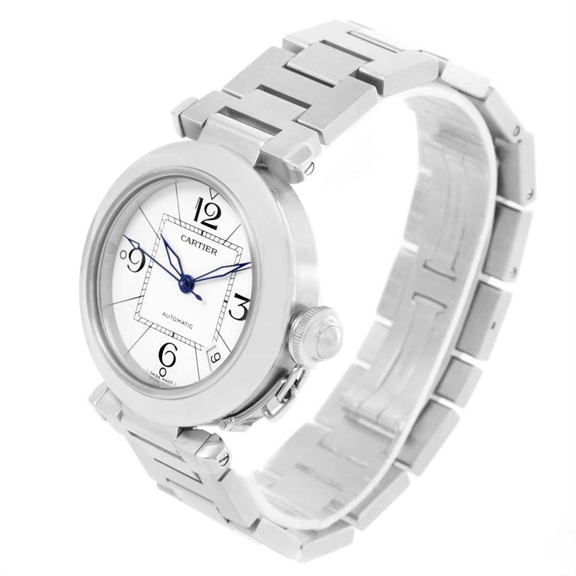 The Cartier Pasha W31074M7 Women's Stainless Steel White Dial W31074M7 Women's Stainless Steel White Dial watch is shown at an angled side view, displaying its face, bracelet, and crown detail.
