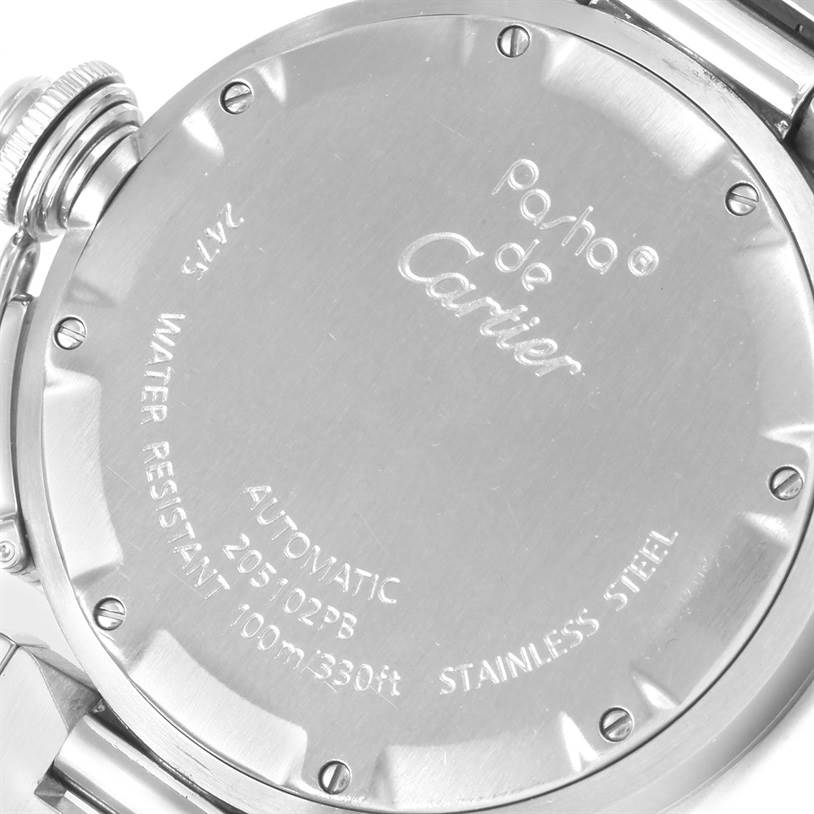 The image shows the back casing and crown of a Cartier Pasha W31058M7 Women's Stainless Steel Pink Dial W31058M7 Women's Stainless Steel Pink Dial watch, displaying details like model number and water resistance.