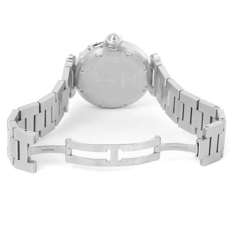 The image shows the back view of a Cartier Pasha W31058M7 Women's Stainless Steel Pink Dial W31058M7 Women's Stainless Steel Pink Dial watch, including its case back and open stainless steel bracelet clasp.