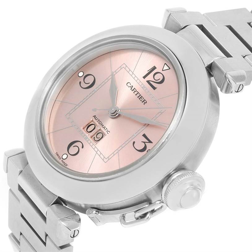 The image shows a Cartier Pasha W31058M7 Women's Stainless Steel Pink Dial W31058M7 Women's Stainless Steel Pink Dial watch at an oblique angle, highlighting its pink dial, case, crown, and part of the bracelet.