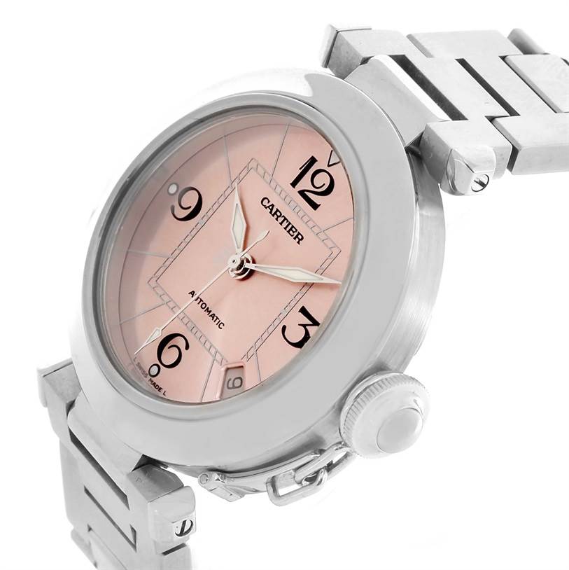 The image shows a side angle of the Cartier Pasha W31075M7 Women's Stainless Steel Pink Dial W31075M7 Women's Stainless Steel Pink Dial watch, displaying its pink dial, bezel, and part of the metal bracelet.