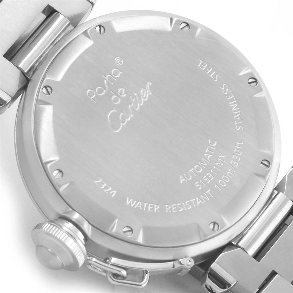 This image shows the back case of the Pasha de Cartier watch, displaying engraved details and part of the metal bracelet.