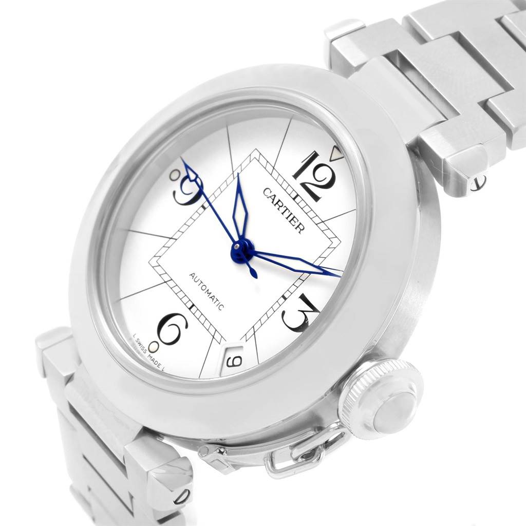 This image shows a Cartier Pasha W31074M7 Women's Stainless Steel White Dial W31074M7 Women's Stainless Steel White Dial watch at an angled close-up, highlighting the dial, blue hands, and partial bracelet.