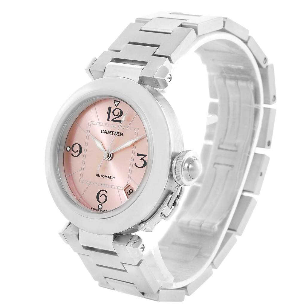 The image shows a Cartier Pasha W31075M7 Women
s Stainless Steel Pink Dial W31075M7 Women
s Stainless Steel Pink Dial watch at an angle highlighting the face, crown, and stainless steel bracelet.