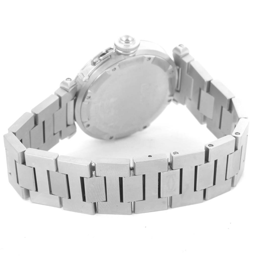 The image shows the back case and metal bracelet of a Cartier Pasha W31075M7 Women
s Stainless Steel Pink Dial W31075M7 Women
s Stainless Steel Pink Dial watch, viewed from an angled side perspective.