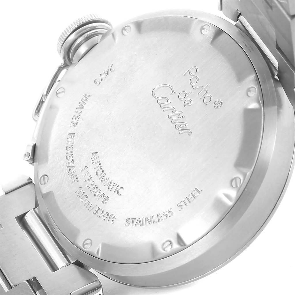 The image shows the stainless steel case back of a Pasha de Cartier watch, highlighting its automatic movement and water resistance.