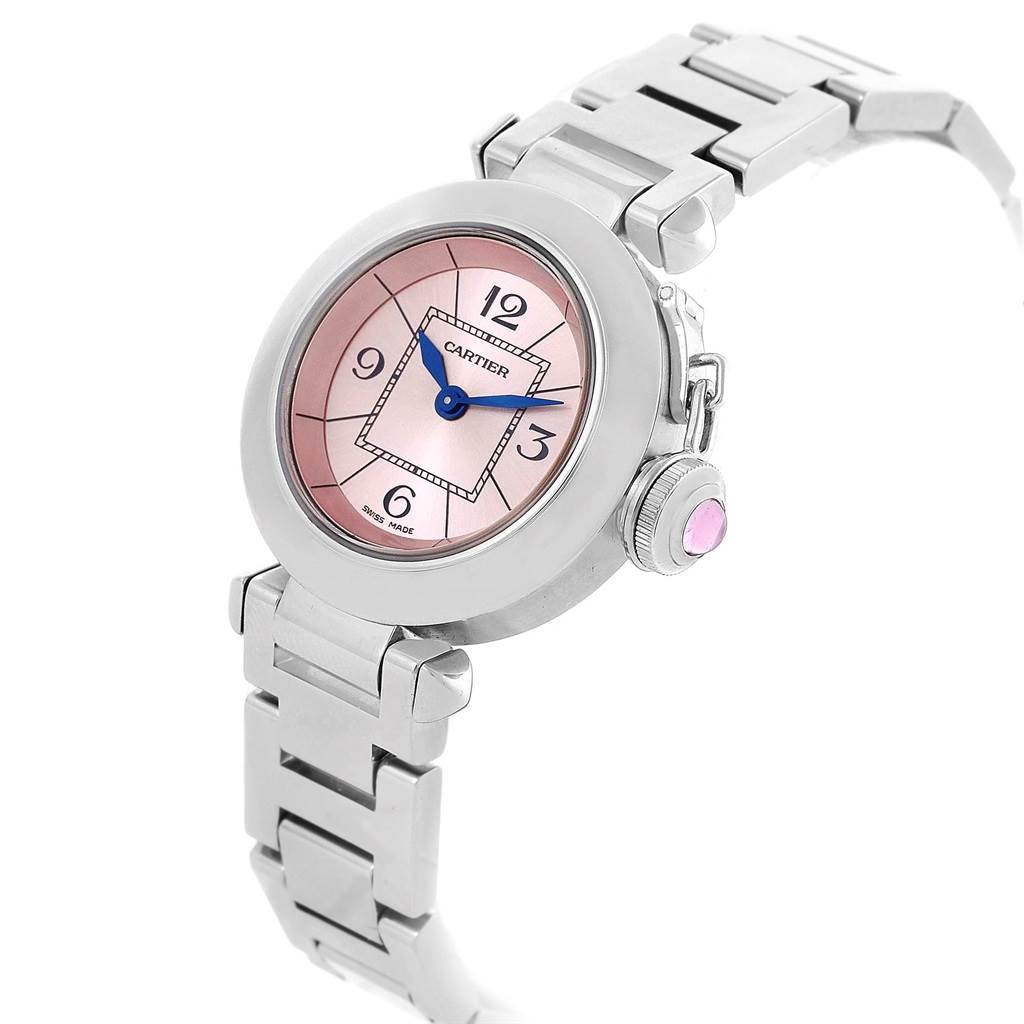 The image shows a Cartier Pasha W3140008 Women's Stainless Steel Pink Dial W3140008 Women's Stainless Steel Pink Dial watch at an angle highlighting the watch face, bezel, bracelet, and crown with a pink gemstone.