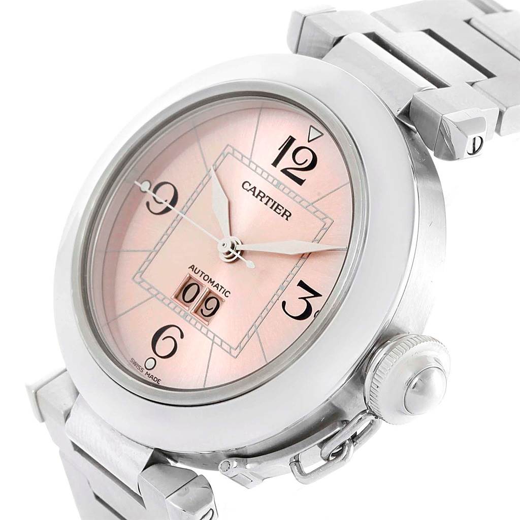 The image shows a Cartier Pasha W31058M7 Women's Stainless Steel Pink Dial W31058M7 Women's Stainless Steel Pink Dial watch from an angled view, highlighting the pink dial, automatic date display, crown, and metal bracelet.