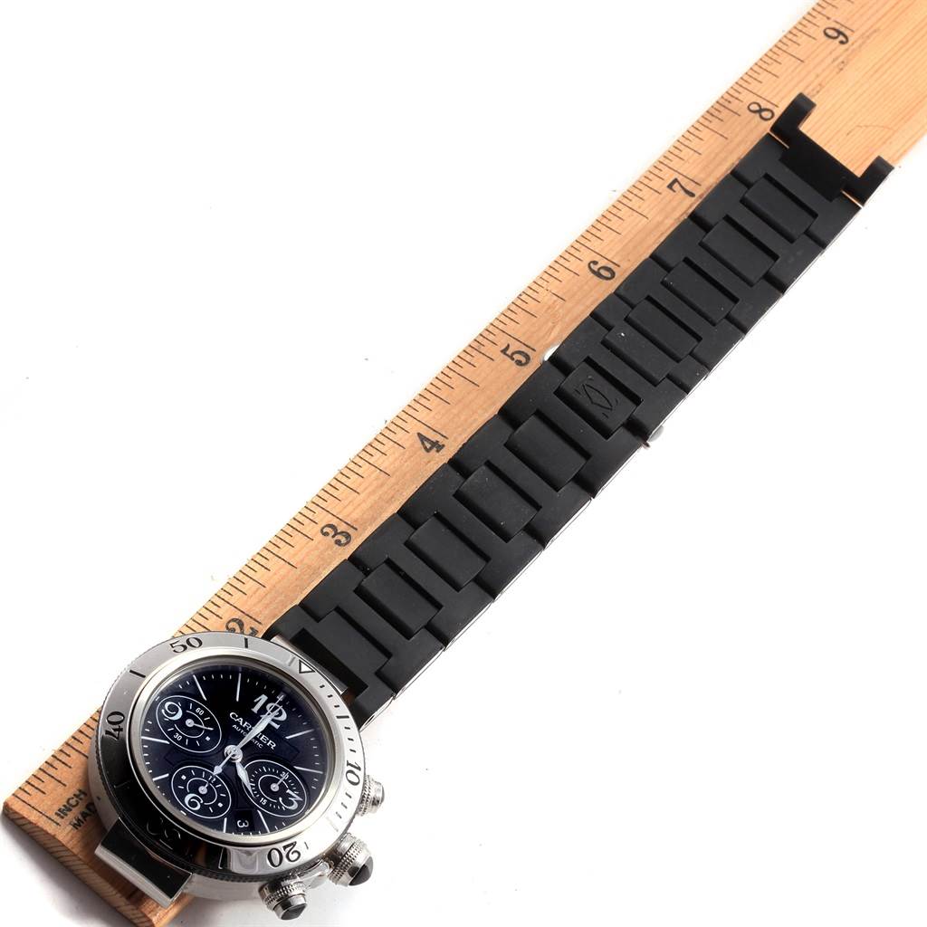 The Cartier Pasha W31088U2 Men
s Stainless Steel Black Dial W31088U2 Men
s Stainless Steel Black Dial watch is shown from a top-down angle, featuring its band measured against a ruler.