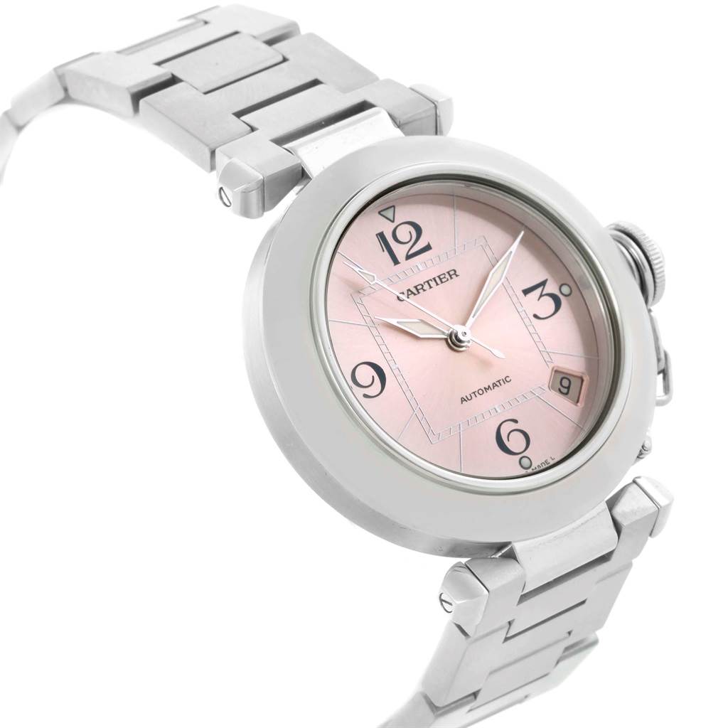 This image shows a Cartier Pasha W31075M7 Men's Stainless Steel Pink Dial W31075M7 Men's Stainless Steel Pink Dial watch at a slight angle, highlighting the watch face, bezel, and part of the bracelet band.