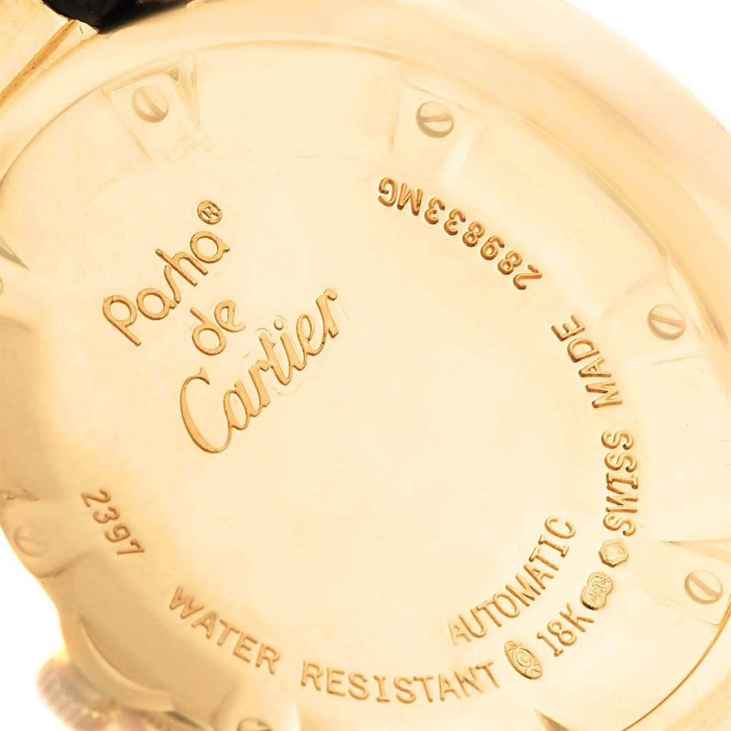 The image shows the back casing of a Pasha de Cartier watch engraved with details about the model, material, and specifications.