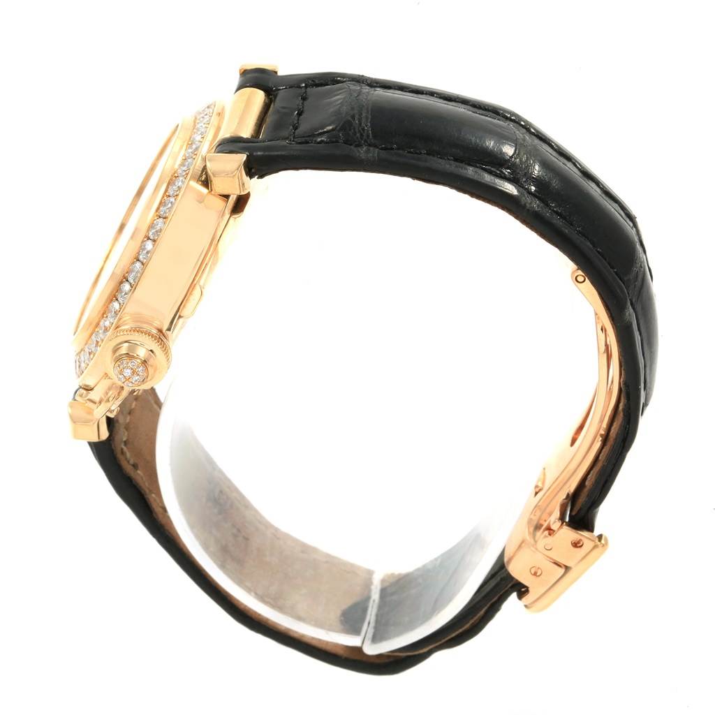 This image shows a Cartier Pasha Women's Yellow Gold Silver Dial Women's Yellow Gold Silver Dial watch from a side angle, highlighting its case, crown, and black strap.