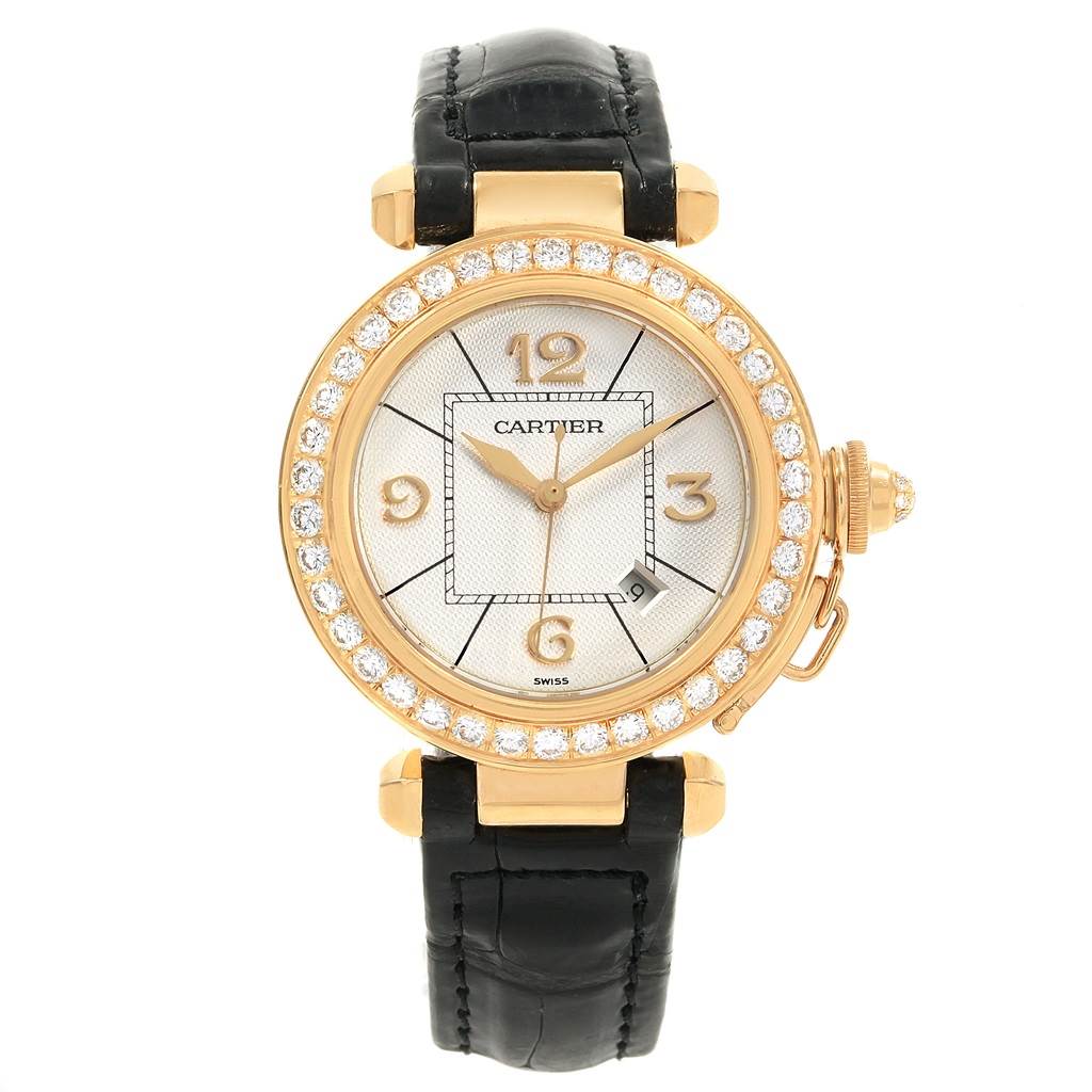 This image displays the Cartier Pasha Women's Yellow Gold Silver Dial Women's Yellow Gold Silver Dial watch's face, bezel, and black strap from a straight-on angle.