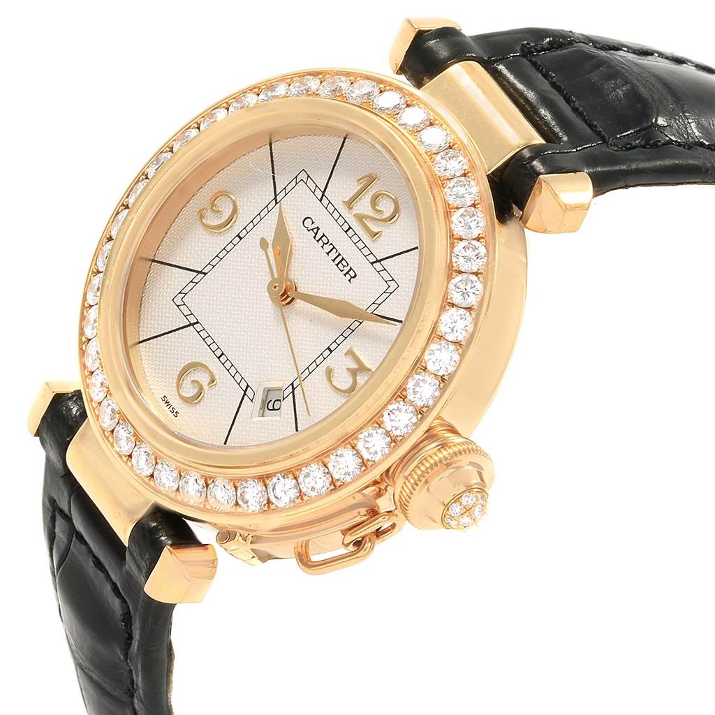 The image shows a Cartier Pasha Women's Yellow Gold Silver Dial Women's Yellow Gold Silver Dial watch at an angle highlighting the face, bezel, crown, and part of the strap.