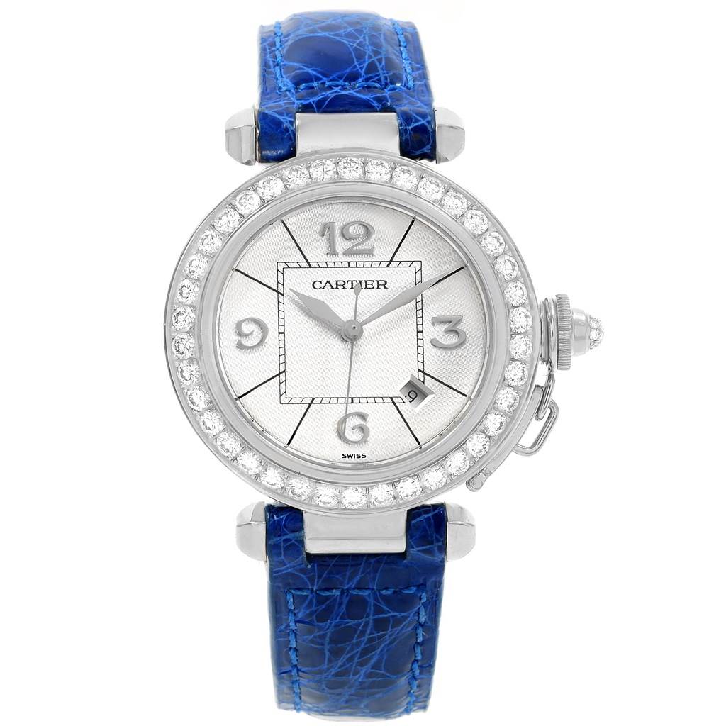 This image shows a front view of a Pasha model watch by Cartier, featuring a blue strap and a diamond-studded bezel.