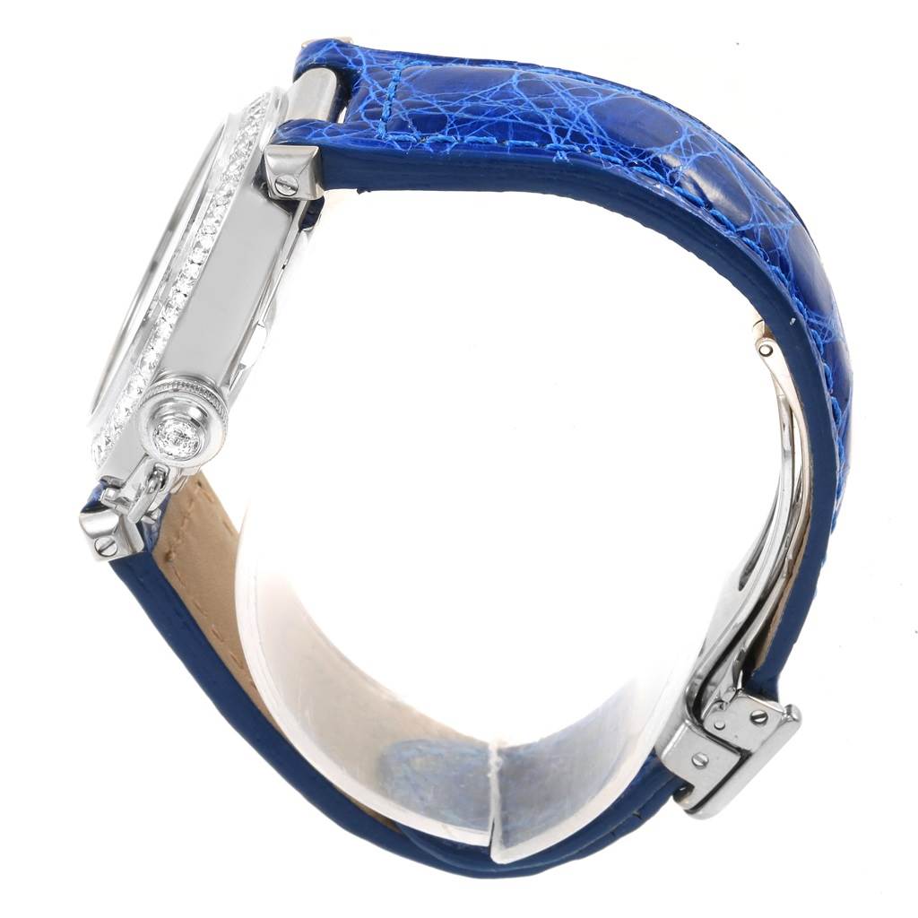 The image shows the side view of a Cartier Pasha Women's White Gold Silver Dial Women's White Gold Silver Dial watch with a blue leather strap and visible crown and clasp.