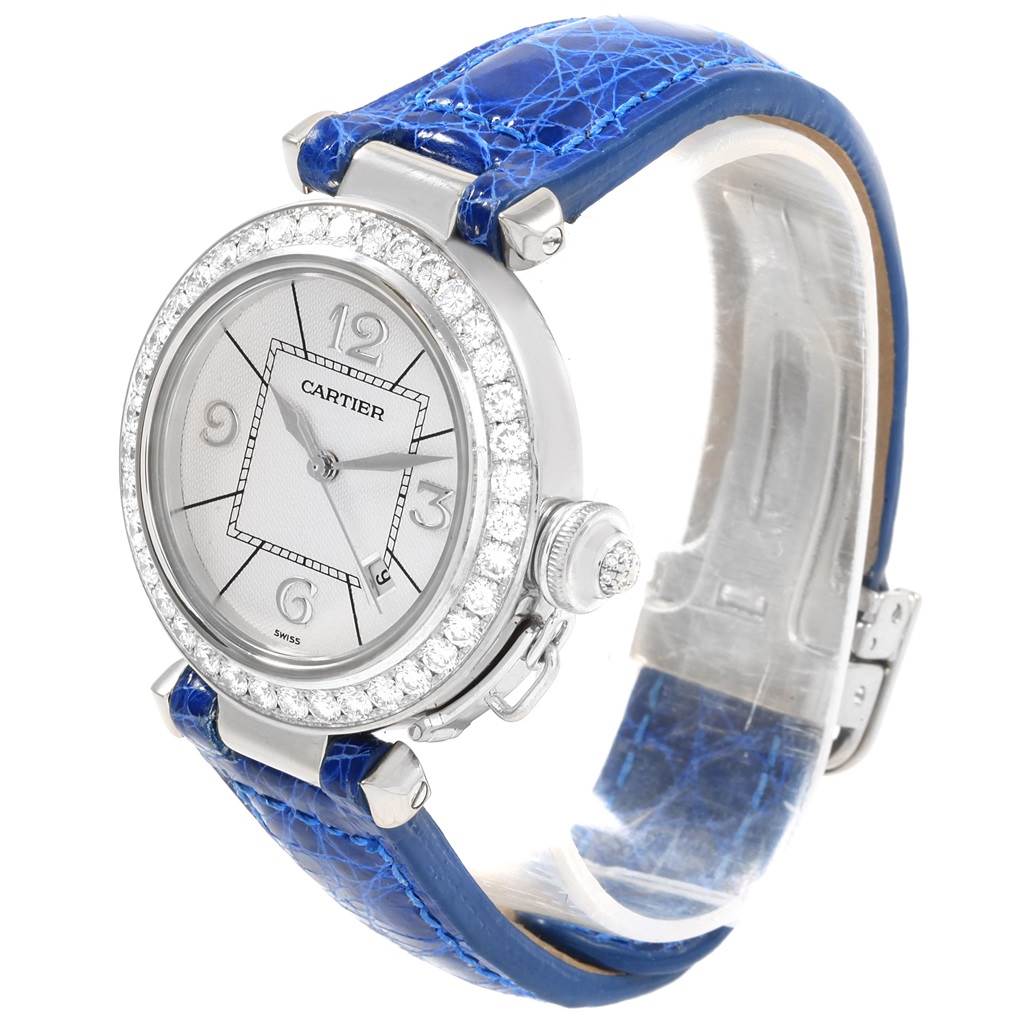The image shows a Cartier Pasha Women's White Gold Silver Dial Women's White Gold Silver Dial watch at a slight angle, highlighting the face, case, bezel, and blue alligator strap.