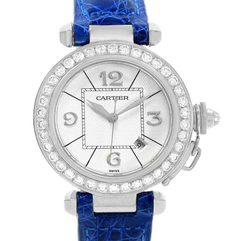 This is a front view of the Cartier Pasha Women's White Gold Silver Dial Women's White Gold Silver Dial watch, showing the face, bezel encrusted with diamonds, and the blue strap.