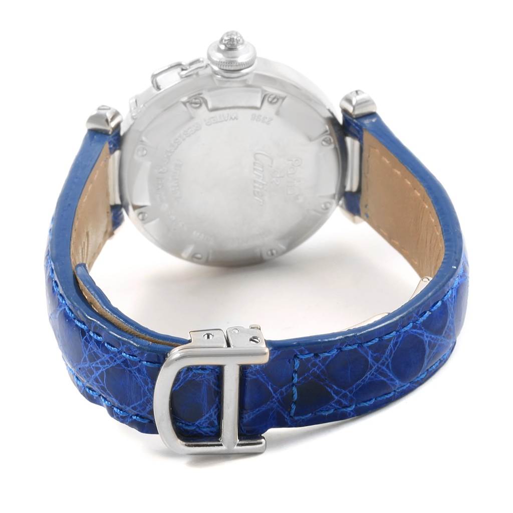 The image shows the back view of a Cartier Pasha Women's White Gold Silver Dial Women's White Gold Silver Dial watch with its blue leather strap and buckle.
