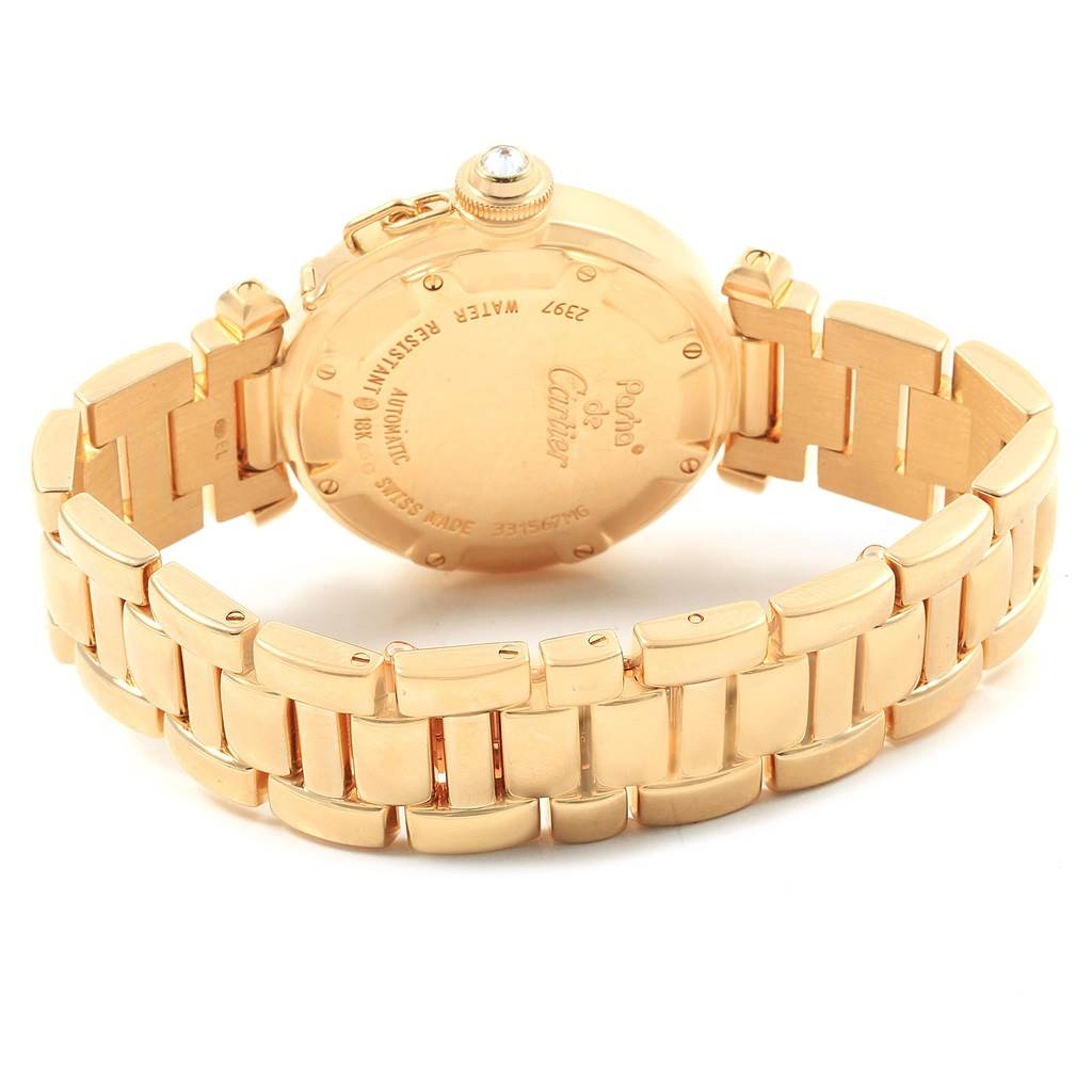 This image shows the back and bracelet of a Cartier Pasha 2397 Women's Yellow Gold Silver Dial 2397 Women's Yellow Gold Silver Dial model watch, highlighting its gold finish and detailing.