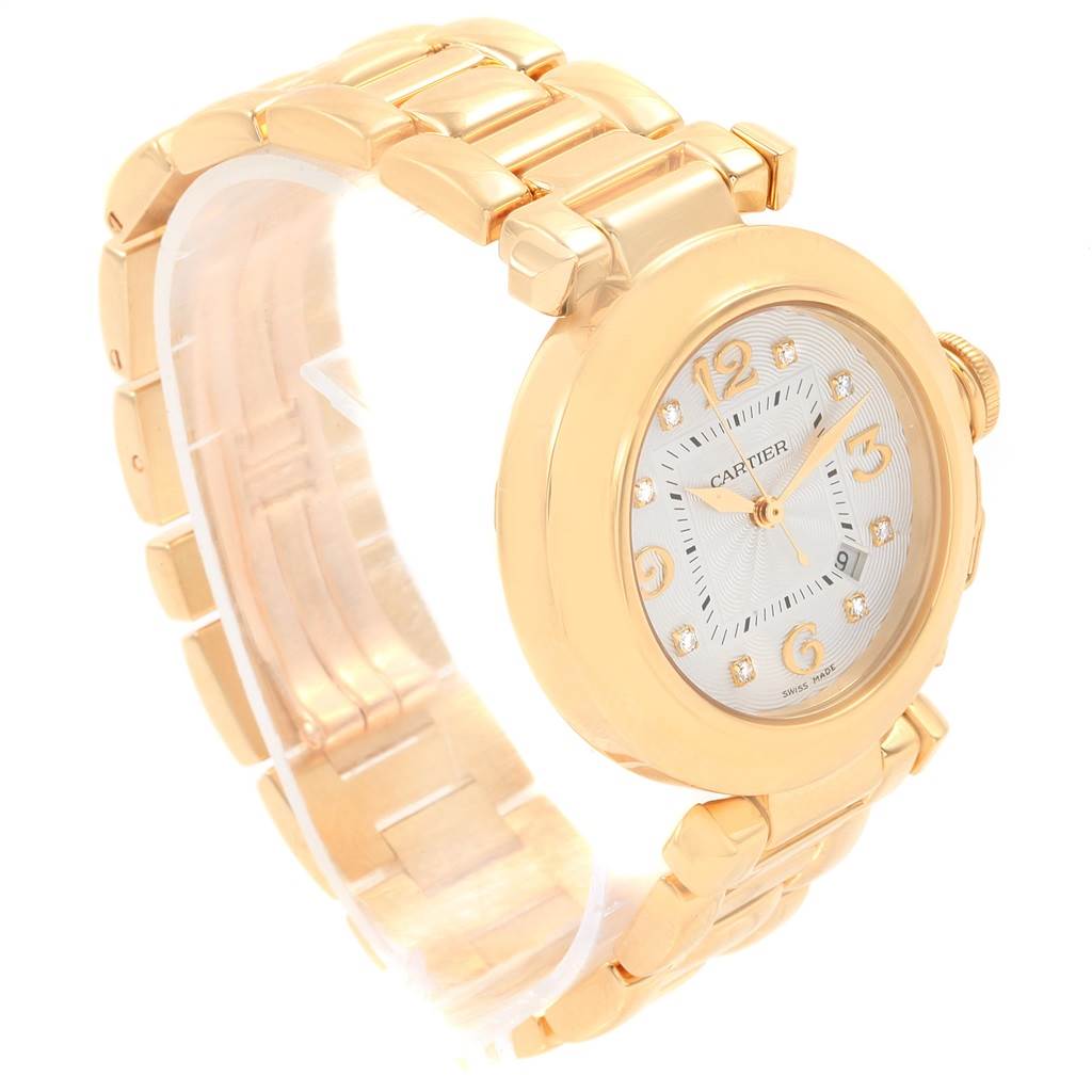 The image shows a side angle view of a Cartier Pasha 2397 Women's Yellow Gold Silver Dial 2397 Women's Yellow Gold Silver Dial watch, highlighting its gold case, bracelet, and dial.