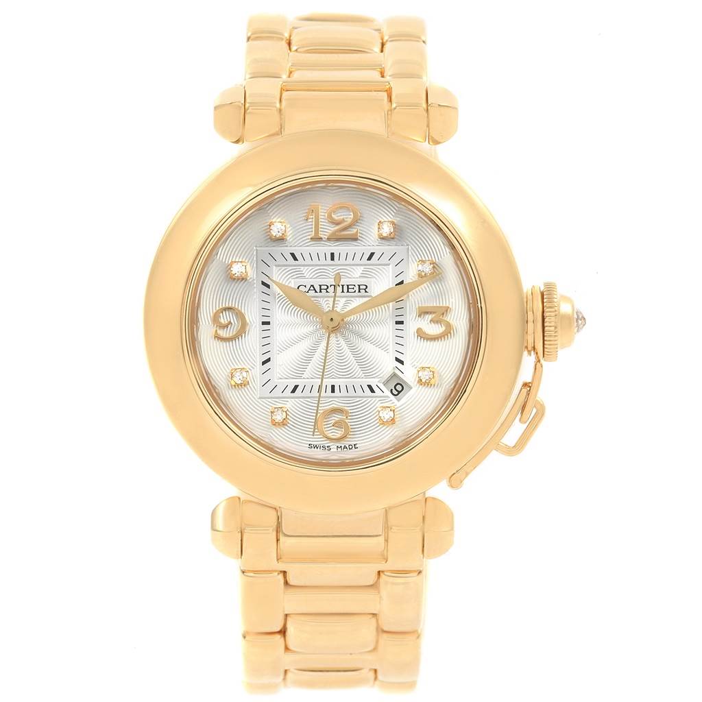 The image shows a Cartier Pasha 2397 Women's Yellow Gold Silver Dial 2397 Women's Yellow Gold Silver Dial watch from a front view, highlighting its round face, gold bracelet, and crown with a cap.