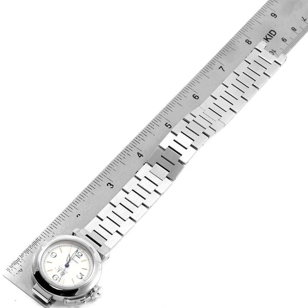 This image shows the full band and face of the Cartier Pasha W31044M7 Men's Stainless Steel White Dial W31044M7 Men's Stainless Steel White Dial watch, positioned alongside a ruler for measurement.