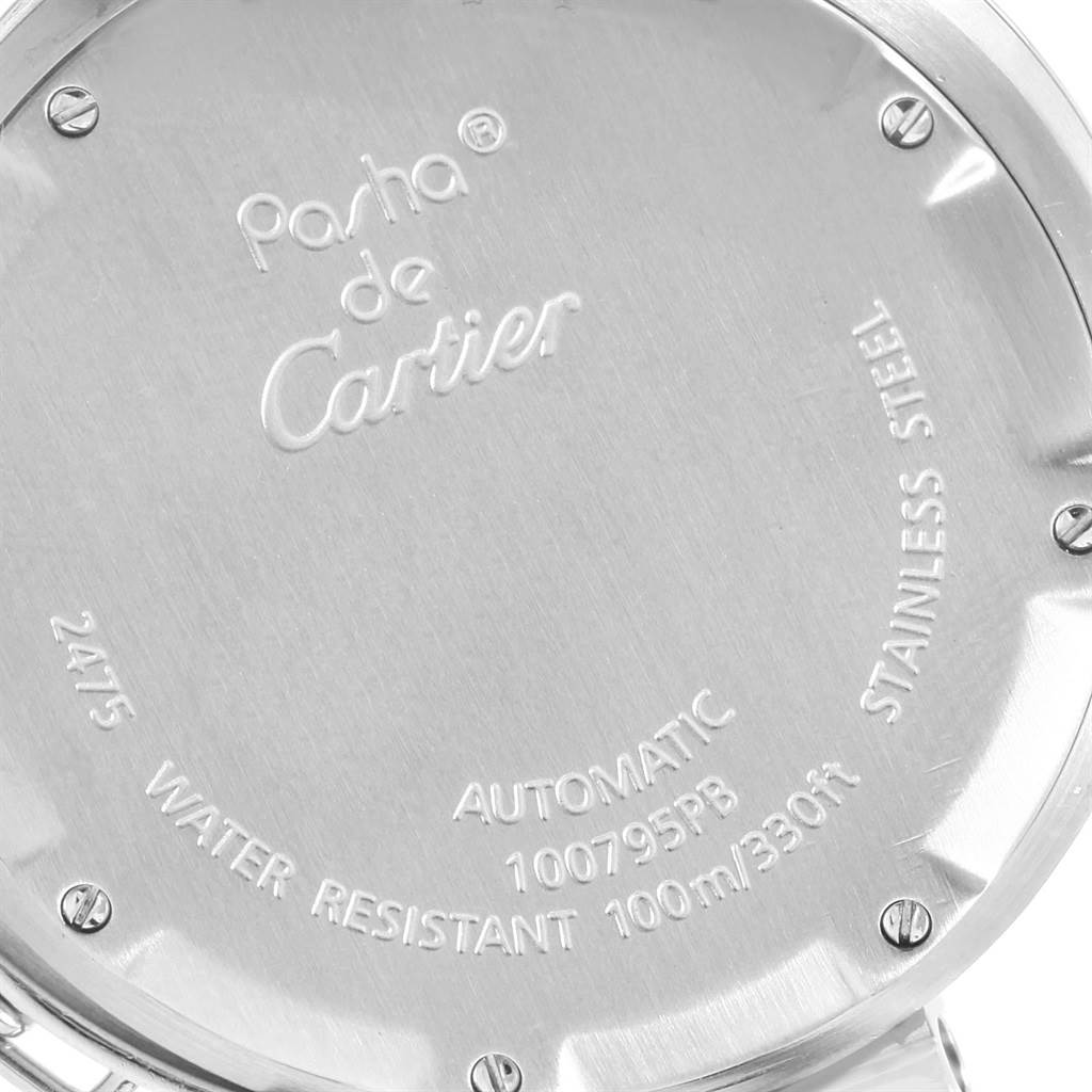 The image shows the back case of the Pasha de Cartier watch, highlighting the engravings and screws.