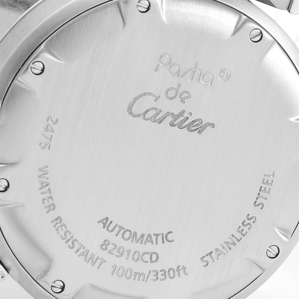 This image shows the back casing of a Pasha de Cartier watch, displaying specifications and branding.