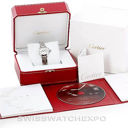This image shows a Cartier Pasha W31043M7 Women
s Stainless Steel Silver Dial W31043M7 Women
s Stainless Steel Silver Dial watch at an angle inside its open box, with accessories including a manual, warranty card, and a CD.