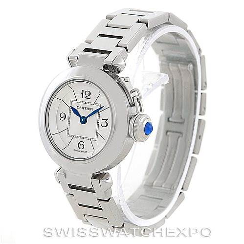 The image shows a Cartier Pasha W31043M7 Women
s Stainless Steel Silver Dial W31043M7 Women
s Stainless Steel Silver Dial watch at a three-quarter angle, highlighting its face, crown with a blue cabochon, and metallic band.