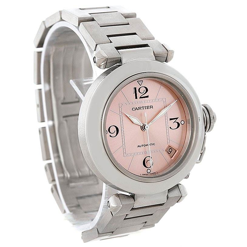 The image shows a full view of a Cartier Pasha W31075M7 Women
s Stainless Steel Pink Dial W31075M7 Women
s Stainless Steel Pink Dial watch at a slight angle, displaying its face, bracelet, and crown.
