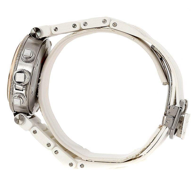 The image shows a side view of a Cartier Pasha W3140004 Men
s Stainless Steel Silver Dial W3140004 Men
s Stainless Steel Silver Dial watch, highlighting the case, pushers, and part of the white strap with its clasp.