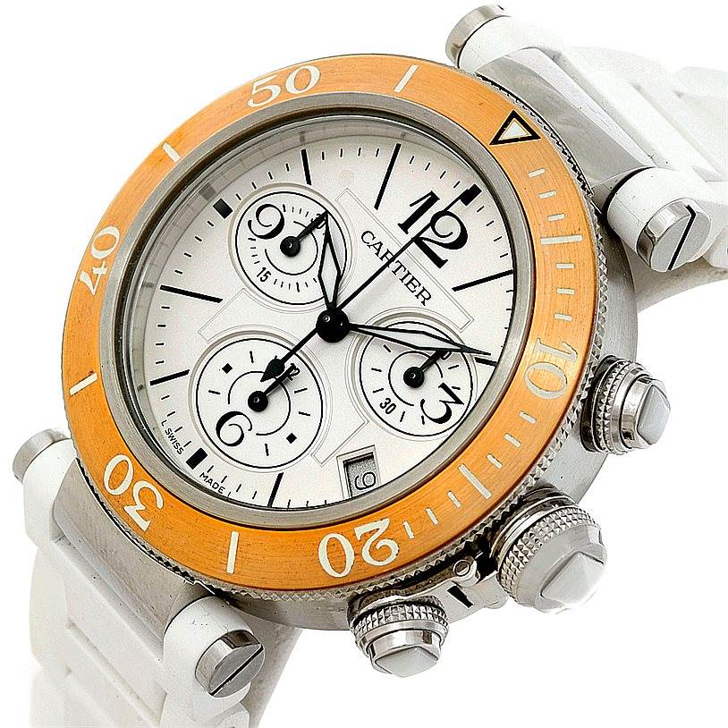 This image shows a Cartier Pasha W3140004 Men
s Stainless Steel Silver Dial W3140004 Men
s Stainless Steel Silver Dial watch at a side angle, highlighting its face, orange bezel, and side buttons.