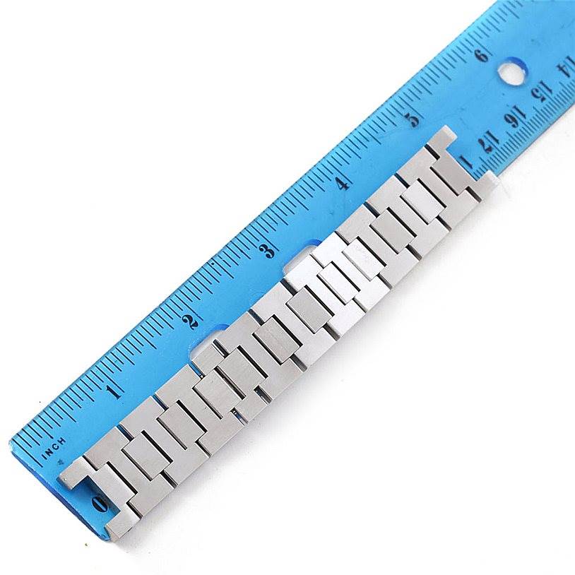 The image shows a metal link bracelet for the Cartier Pasha W31015M7 Women's Stainless Steel White Dial W31015M7 Women's Stainless Steel White Dial watch model next to a blue ruler for measurement.