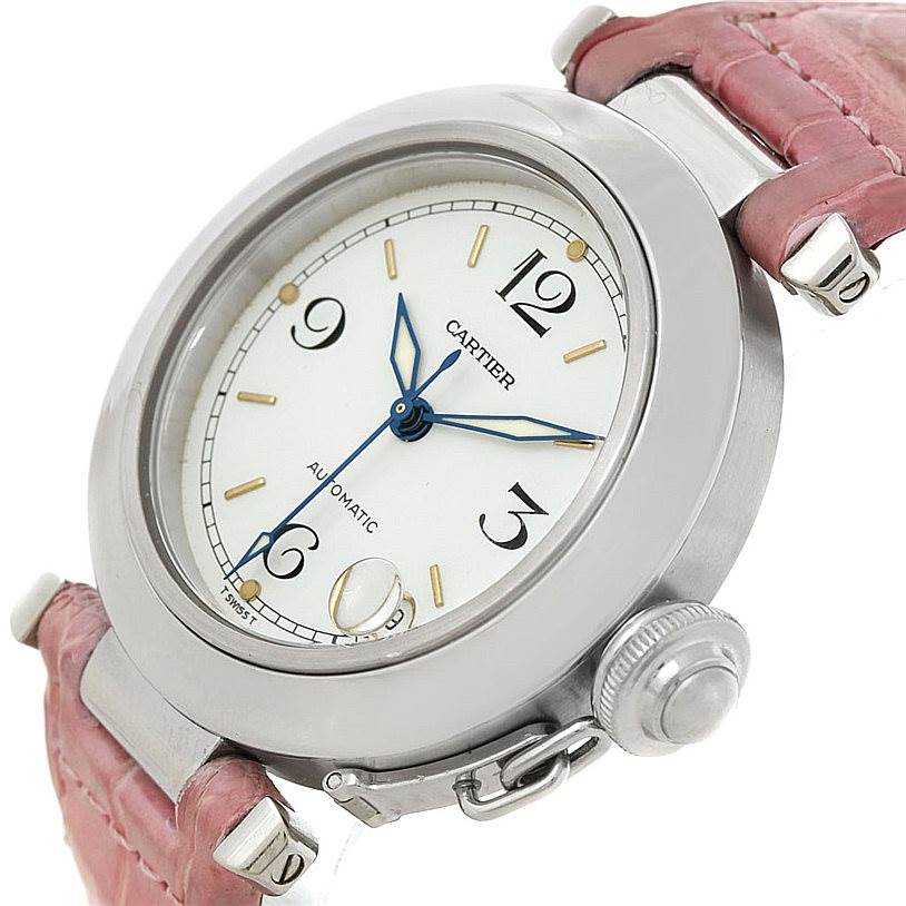 This image shows a close-up angle of the Cartier Pasha W31015M7 Women's Stainless Steel White Dial W31015M7 Women's Stainless Steel White Dial watch, highlighting its dial, crown, and pink leather strap.