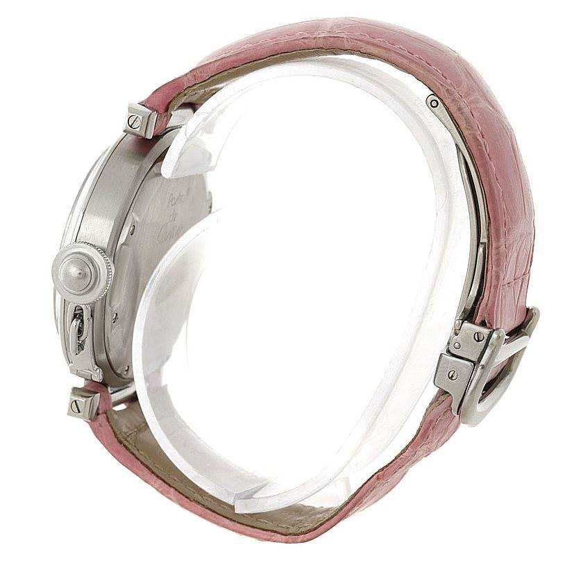 This side-angle view of the Cartier Pasha W31015M7 Women's Stainless Steel White Dial W31015M7 Women's Stainless Steel White Dial watch shows the crown, caseback, and pink leather strap with a metal buckle.