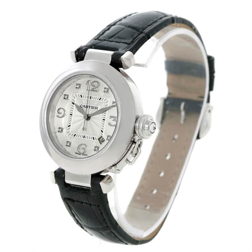 The Cartier Pasha WJ11902G Women's White Gold Silver Dial WJ11902G Women's White Gold Silver Dial watch is shown at a three-quarter angle, highlighting the dial, crown, and black leather strap.