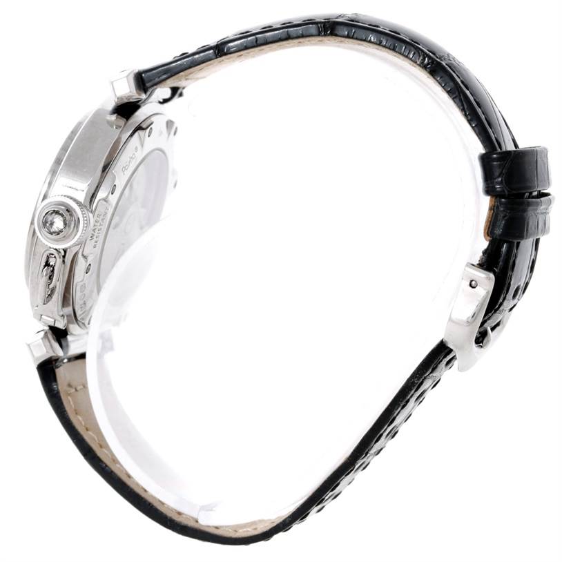 The image shows a side view of a Pasha model watch by Cartier, emphasizing the watch case, crown, and leather strap.