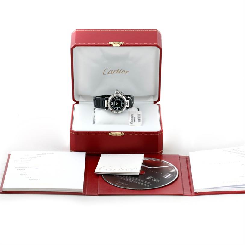 The image shows a Cartier Pasha W3140003 Women's Stainless Steel Black Dial W3140003 Women's Stainless Steel Black Dial watch in its open box, accompanied by warranty cards and a CD.