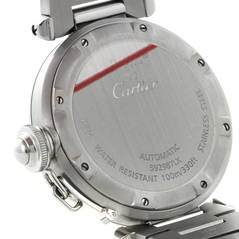 This image shows the back of a Pasha model watch by Cartier, highlighting the stainless steel case and markings.