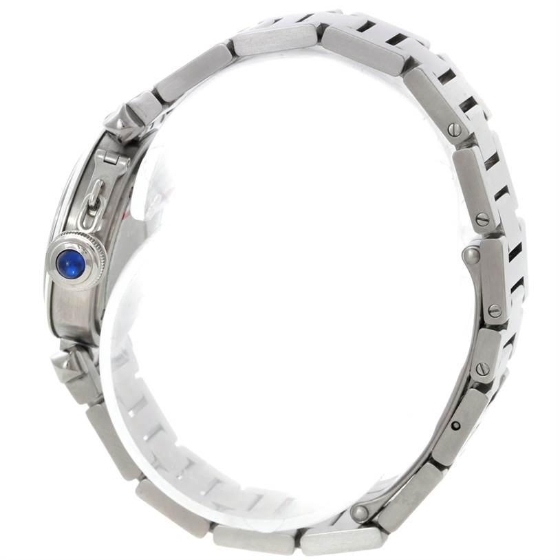 The image shows a side view of a Cartier Pasha W31043M7 Women
s Stainless Steel Silver Dial W31043M7 Women
s Stainless Steel Silver Dial watch, highlighting its stainless steel bracelet and crown with a blue cabochon.