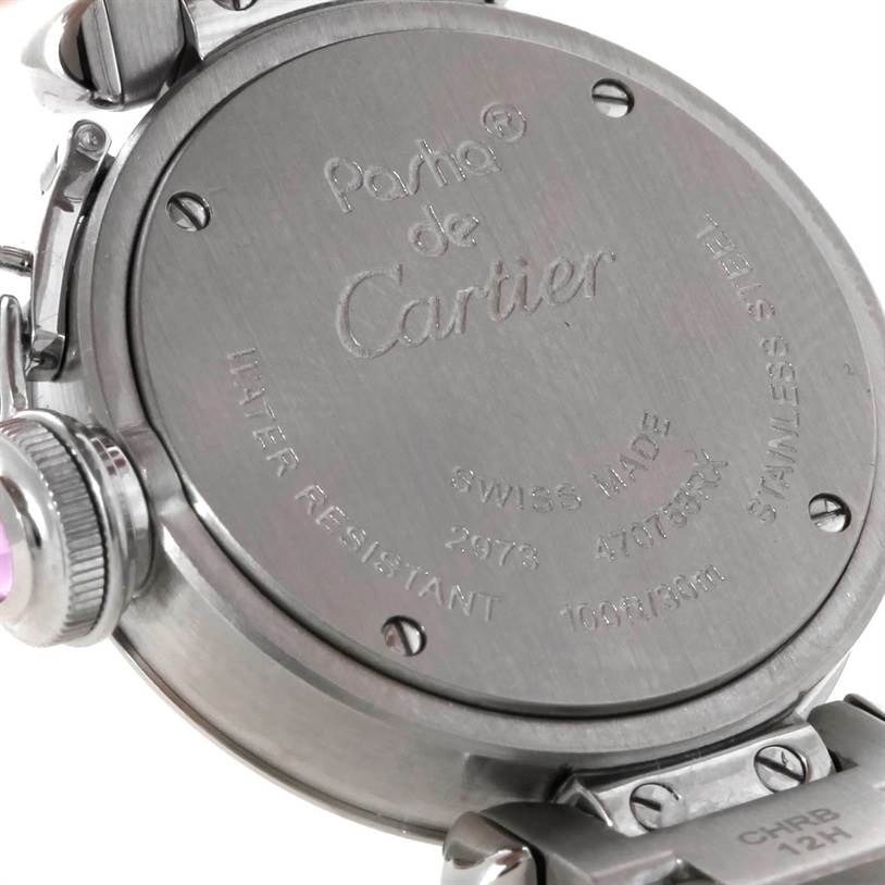This image shows the back case of a Cartier Pasha W3140008 Women
s Stainless Steel Pink Dial W3140008 Women
s Stainless Steel Pink Dial watch, displaying engraved details and part of the bracelet.