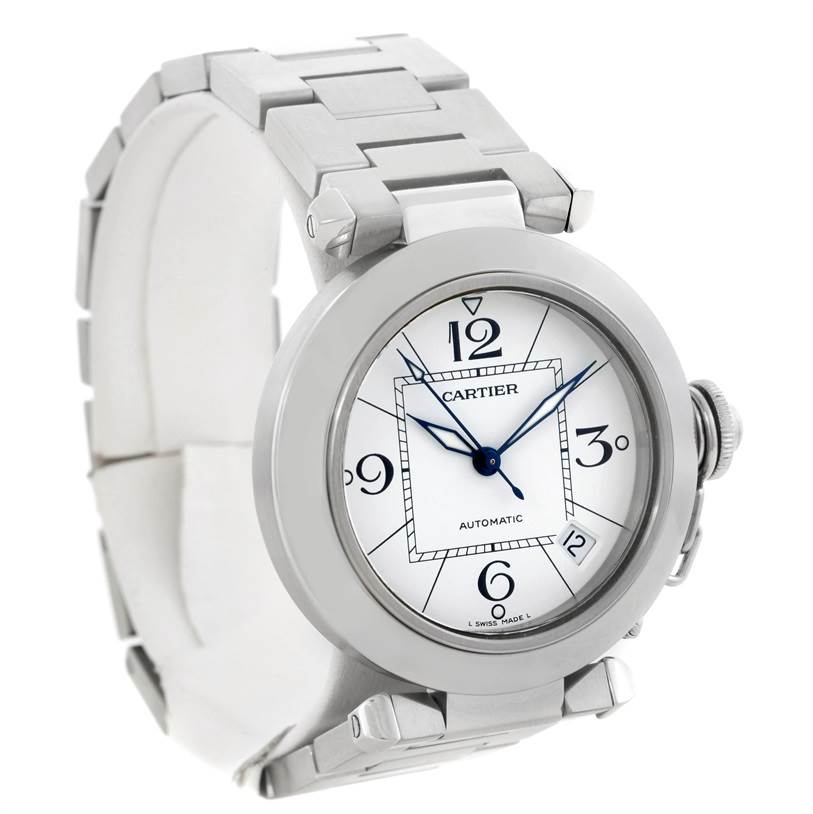 The image shows a front-left angled view of a Cartier Pasha W31074M7 Women's Stainless Steel White Dial W31074M7 Women's Stainless Steel White Dial model watch, highlighting its dial, bezel, and bracelet.