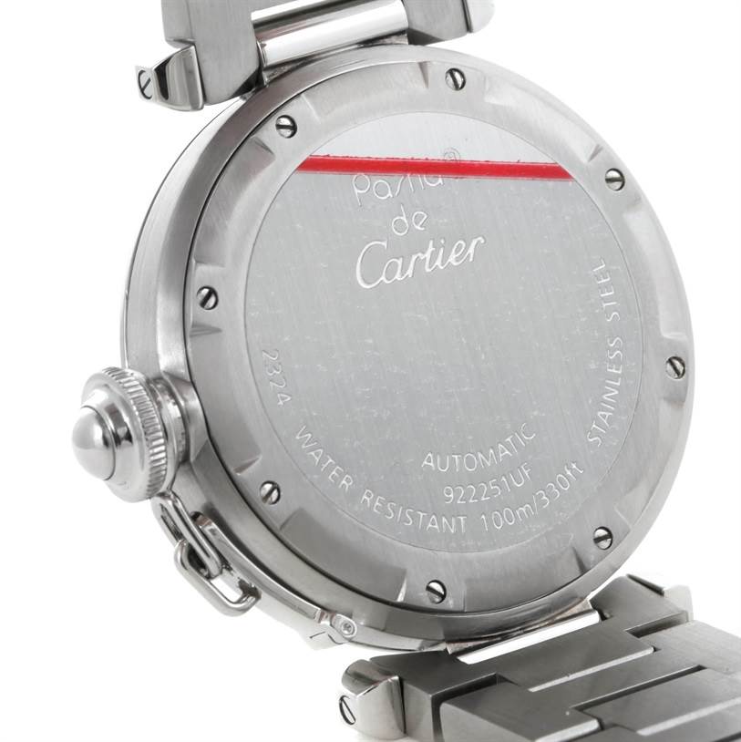 This image shows the rear case and parts of the metal bracelet of a Cartier Pasha W31074M7 Women's Stainless Steel White Dial W31074M7 Women's Stainless Steel White Dial model watch.