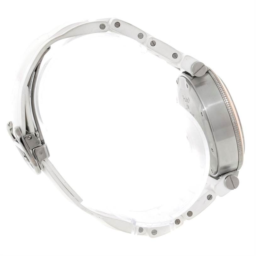 The image shows a side view of the Cartier Pasha W3140004 Stainless Steel Silver Dial W3140004 Stainless Steel Silver Dial watch, focusing on its crown, case, and part of its metal bracelet.