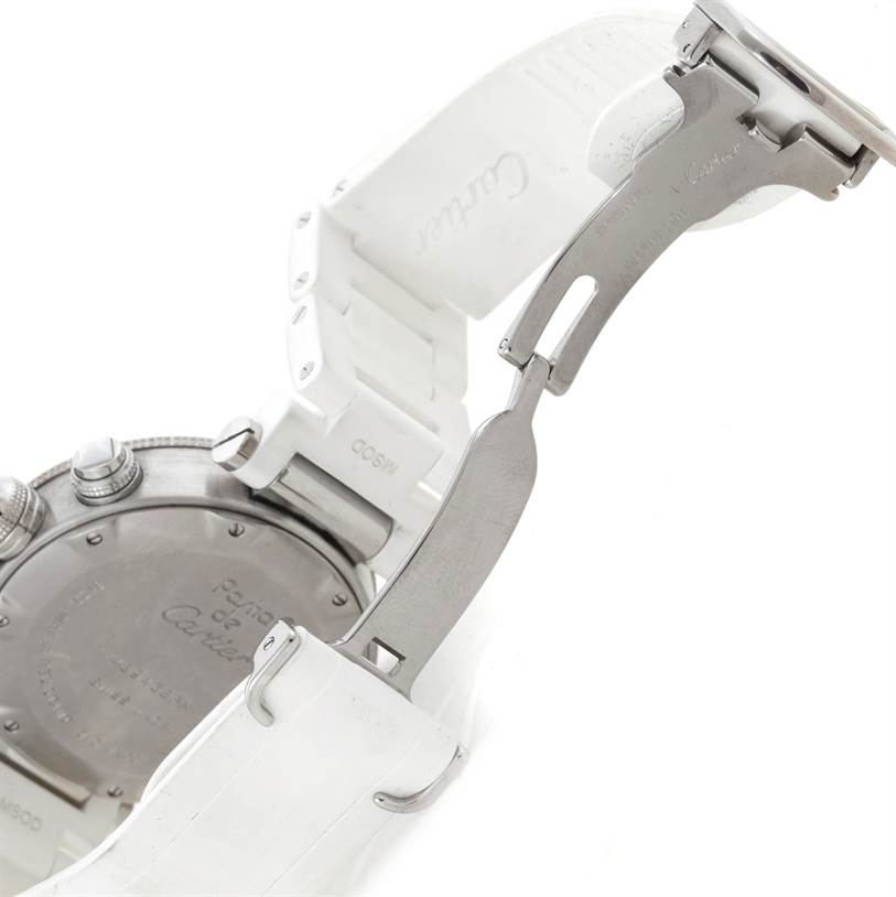 The image shows the back and clasp of a white Pasha de Cartier watch, including a partially open metal buckle.