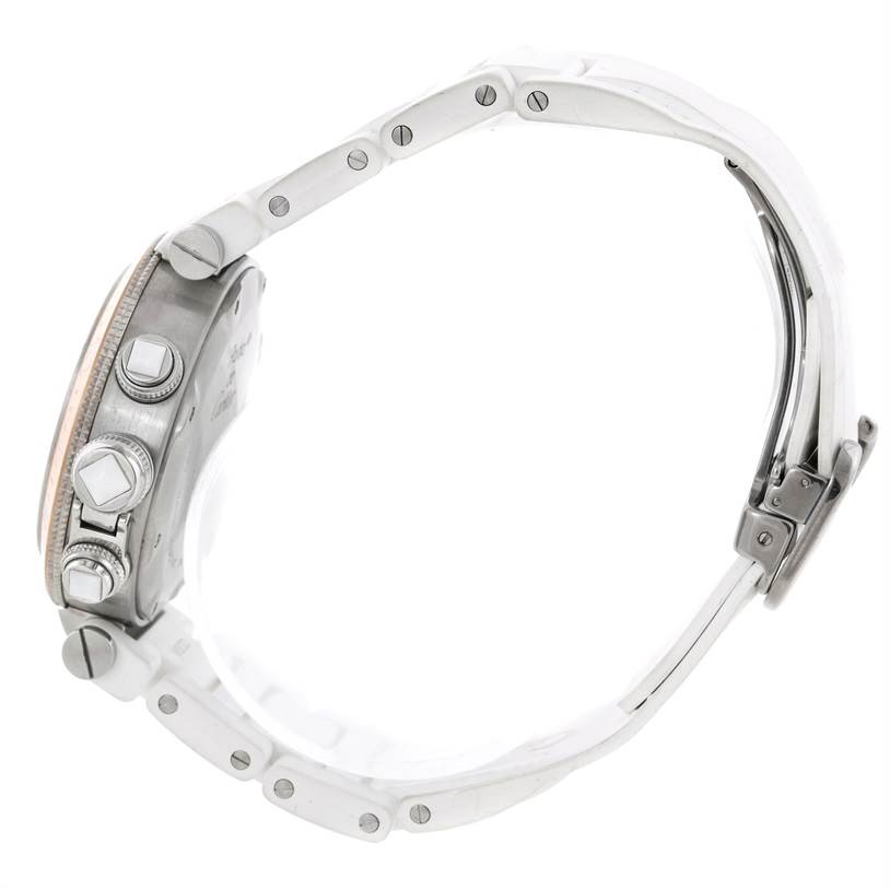 This side view of the Cartier Pasha W3140004 Stainless Steel Silver Dial W3140004 Stainless Steel Silver Dial watch shows the crown, pushers, case side, and part of the bracelet.