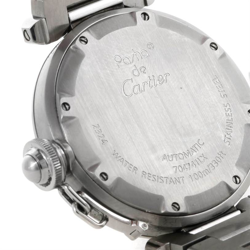 This image shows the back case of a Cartier Pasha W31075M7 Women
s Stainless Steel Pink Dial W31075M7 Women
s Stainless Steel Pink Dial watch, displaying the engravings and the crown.